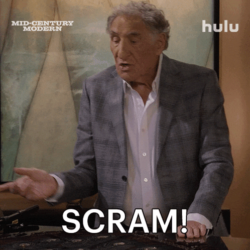 a man in a suit says scram in front of a sign that says hulu