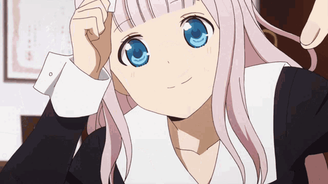 an anime girl with pink hair and blue eyes