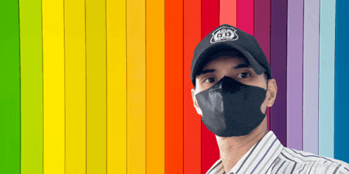 a man wearing a mask and a hat with a gd logo on it
