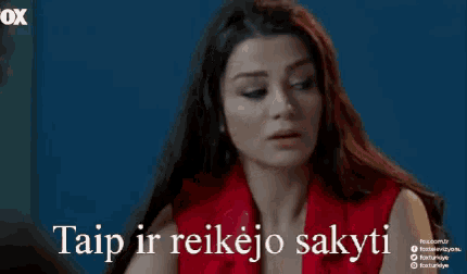 a woman in a red shirt is holding her head with the words taip ir reikejo sakyti written on the bottom