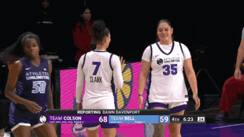 a basketball game is being played between the athletes unlimited and the team bell
