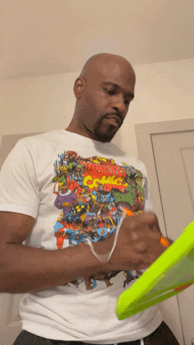 a man wearing a marvel comic t-shirt