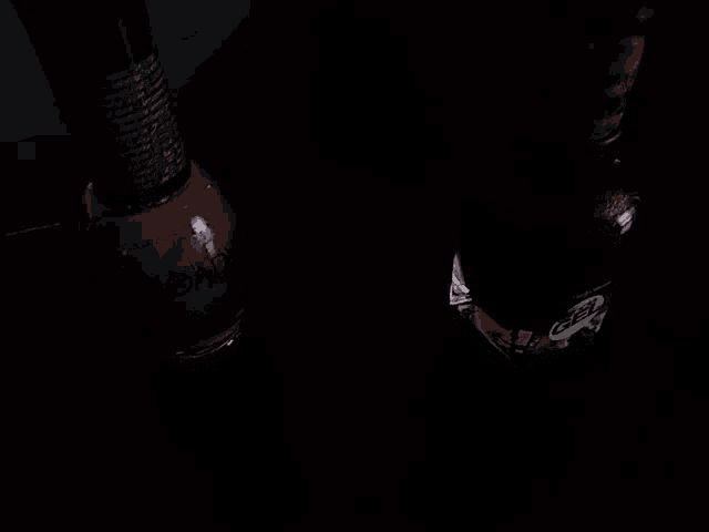 two bottles of nail polish one of which is red