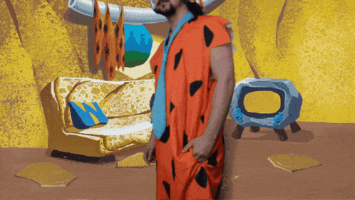 a man in a flintstones costume stands in front of a couch and television