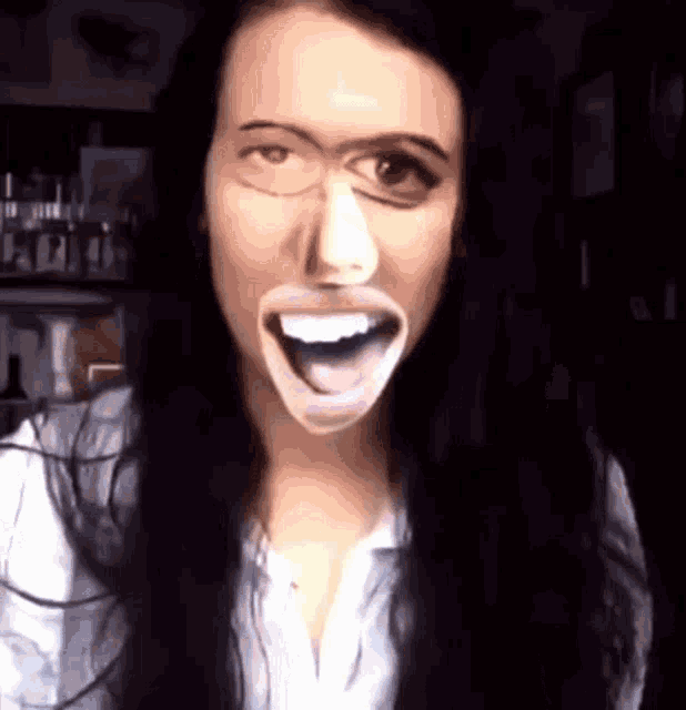 a woman with a big mouth is making a face