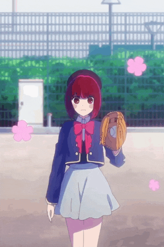 a girl with red hair is holding a baseball glove in her right hand