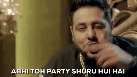 a man with a beard is making a funny face and saying abhi toh party shuru hui hai .