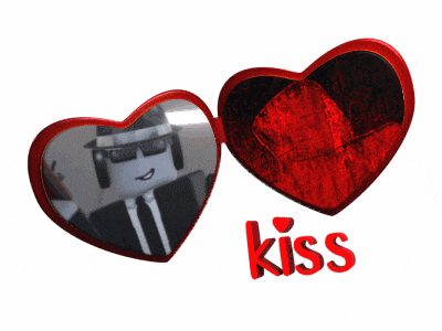 a picture of a man in a suit and tie behind two red hearts that say kiss