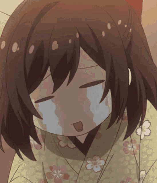 a girl in a kimono is crying with her eyes closed and tears running down her face