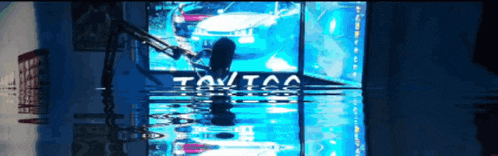 a reflection of a car in a window with the word toy on it