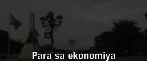 a blurred image of a park with the words para sa ekonomiya written on it