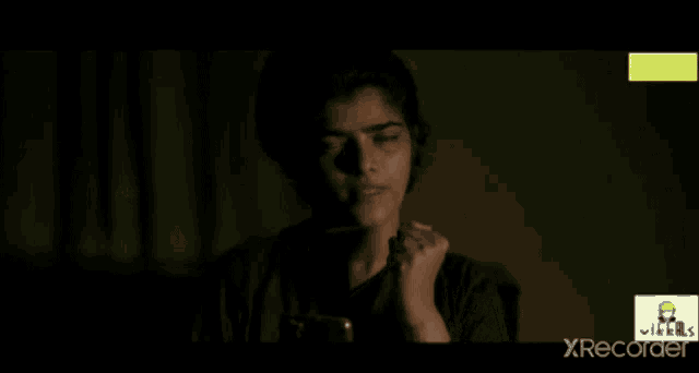 a woman says " good night " in a dark room