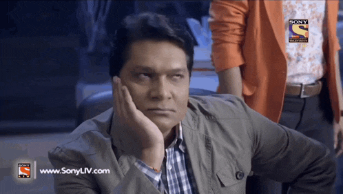 a man with his hand on his face is on a screen that says www.sonyliv.com