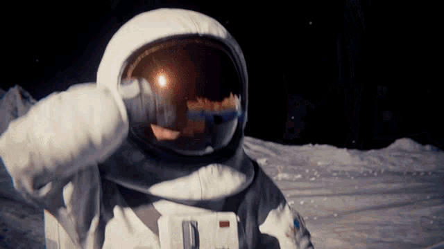 a close up of an astronaut 's helmet with the word nasa on the front