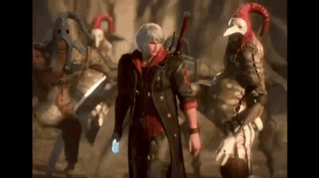 a man in a devil may cry video game is standing in front of a group of people in costumes .