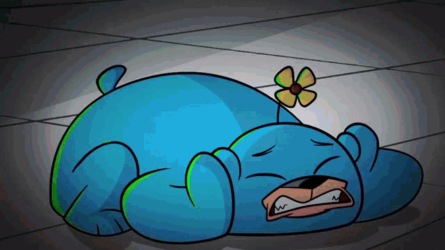a blue bear with a yellow flower on its head