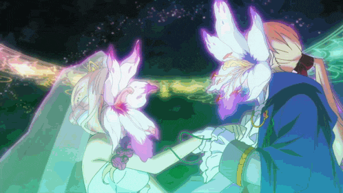 a bride and groom with flowers in their hair are kissing