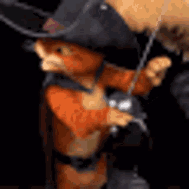 a cat wearing a cowboy hat and boots is holding a sword .