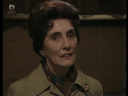 a woman 's face is shown on a television screen with the letter d above her