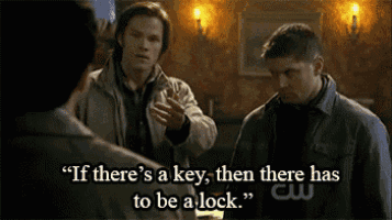 two men are standing next to each other and one of them is talking about a key