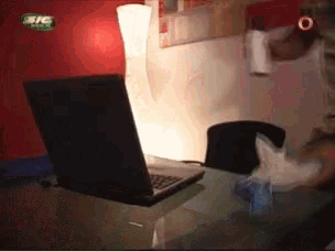a laptop sits on a desk in front of a sign that says ' efc ' on it