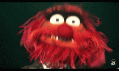 a close up of a cartoon character 's face with big eyes