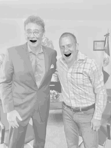 two men posing for a picture with their mouths wide open