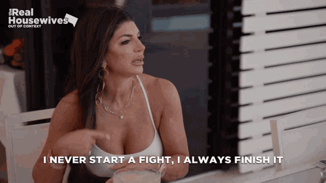 a woman sitting at a table with the words " i never start a fight , i always finish it "