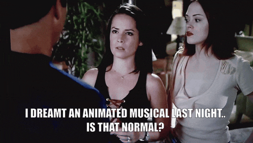 two women are standing next to each other with a caption that says " i dreamt an animated musical last night is that normal "