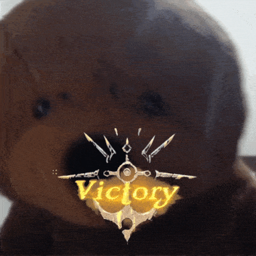 a picture of a stuffed animal with the word victory on the bottom