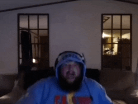 a man with a beard wearing a hoodie that says eagles