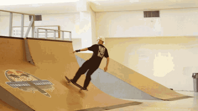 a skateboarder is doing a trick on a ramp that says red bull