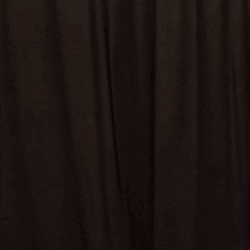 a blurry picture of a man in a suit dancing