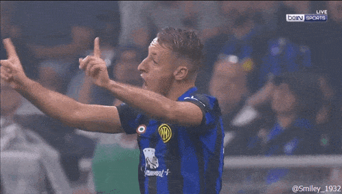 a soccer player is giving the middle finger while wearing a jersey that says summit +