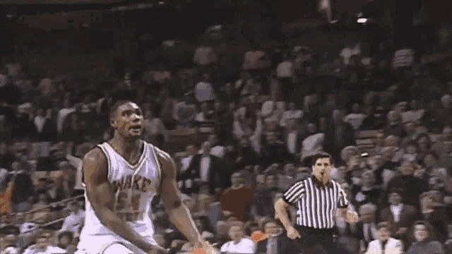 a basketball is going through a hoop with a sign that says winston on it