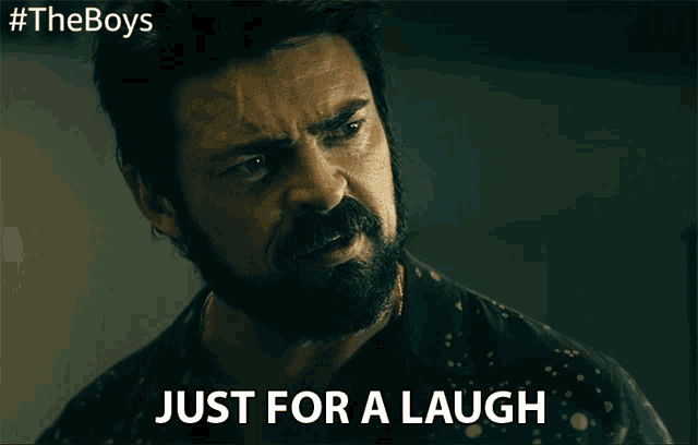 a man with a beard says just for a laugh on a poster