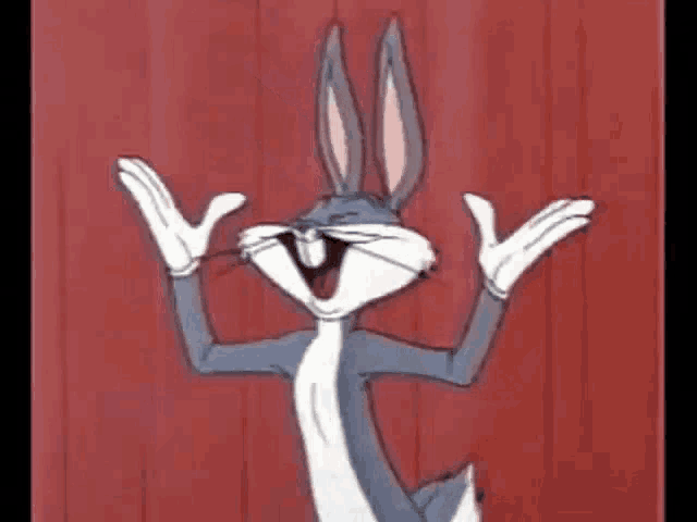 bugs bunny is standing in front of a red curtain with his arms outstretched and smiling .