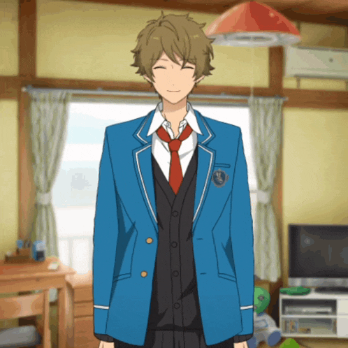 a boy in a blue jacket and red tie is smiling