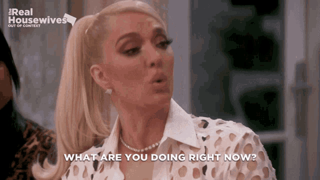 a woman says what are you doing right now in front of a real housewives logo