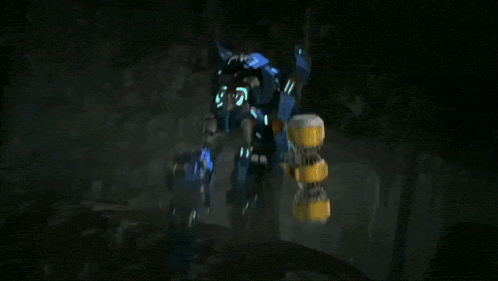 a blurred image of a robot with sparks coming out of its mouth