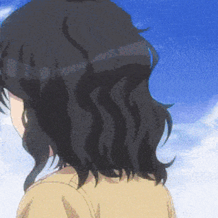 a close up of a person 's head with a blue sky in the background