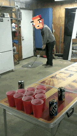 a man is playing beer pong with a can of lite on the table