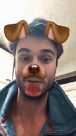 a man is wearing a dog mask with ears and a tongue sticking out