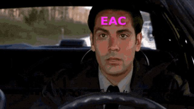 a truck carrying logs is driving down a road with a sign that says ' etat ' on it