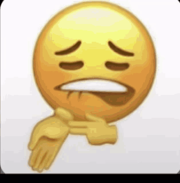 a close up of a smiley face with a hand covering it 's mouth .