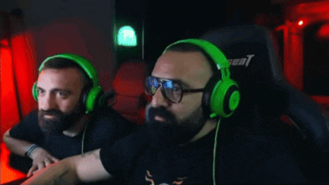 a blurry picture of two men wearing headphones and glasses
