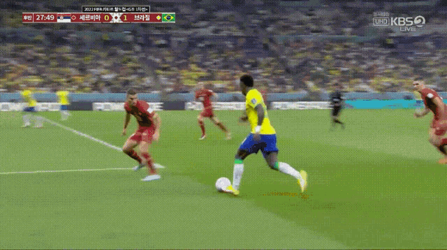 two soccer players are celebrating a goal during a game on kbs2