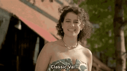 a woman in a strapless top is smiling and says classic val