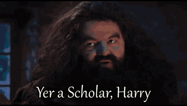 harry potter wearing a graduation cap holding a diploma