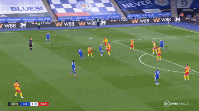 a soccer game is being played in front of a checkered banner that says never give up blues